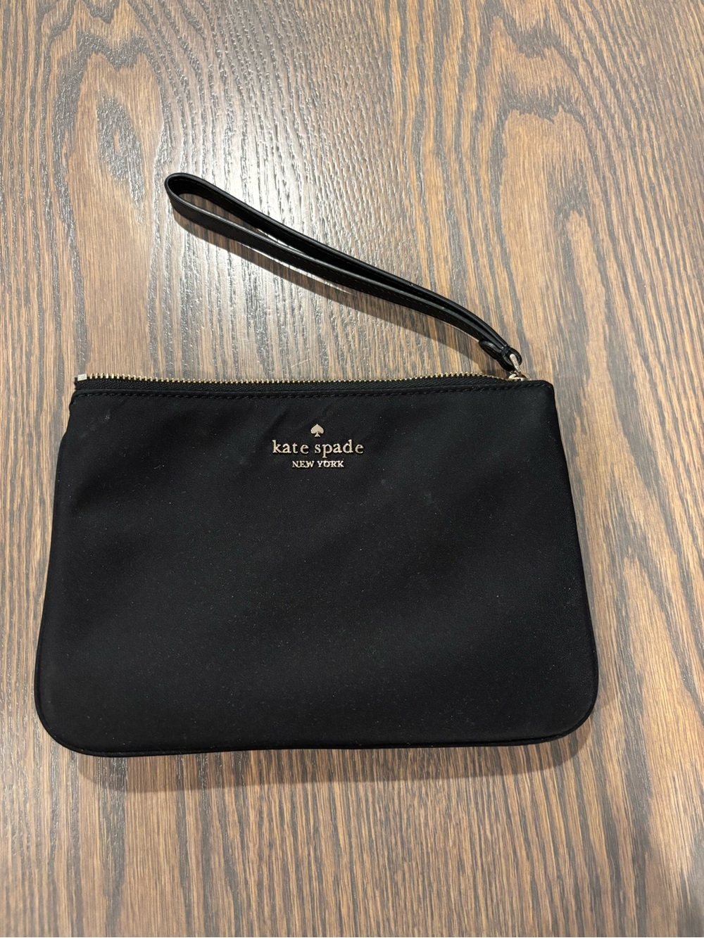 kate spade black wristlet toiletry pouch with gold logo